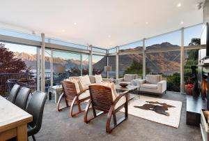 a living room with a view of the mountains at Remarkable Escape for 8 in Queenstown +46 photos