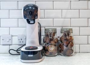 a blender sitting on a counter next to glass jars at No6 - Beverley - Elegant Townhouse - Central location in Beverley