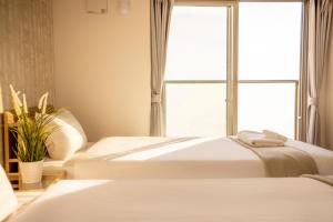 Letto o letti in una camera di RTi Tennoji