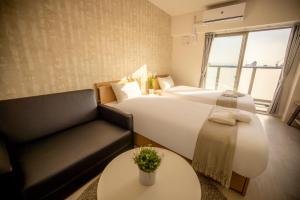 Letto o letti in una camera di RTi Tennoji