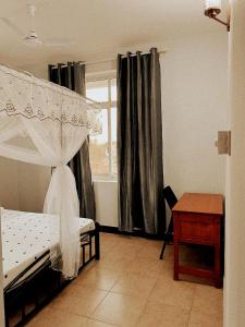 Ein Bett oder Betten in einem Zimmer der Unterkunft Haika Home Lodge
