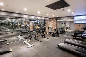a gym with a lot of treadmills and machines at Hotel Bernoui Seoul in Seoul