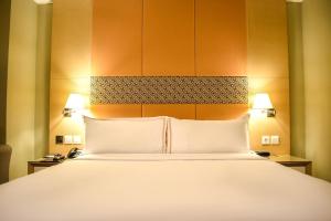 Katil atau katil-katil dalam bilik di All Sedayu Hotel Kelapa Gading