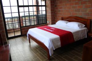 Voodi või voodid majutusasutuse Hotel International toas