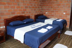 Voodi või voodid majutusasutuse Hotel International toas
