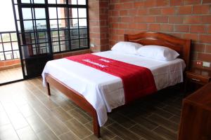 Voodi või voodid majutusasutuse Hotel International toas