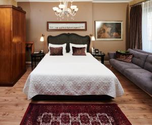 a bedroom with a large bed and a couch at Faik Pasha Hotels Special Category Beyoglu Istanbul in Istanbul +223 photos