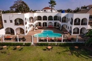 an aerial view of a white house with a swimming pool at Harmony Resort Boutique Hotel in Bathurst