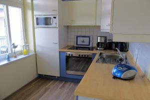 a kitchen with a sink and a counter top at Anna-App-10 in Ahlbeck