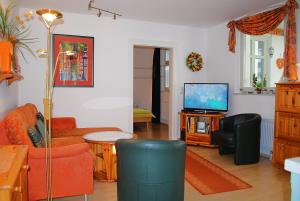 Μια τηλεόραση ή/και κέντρο ψυχαγωγίας στο Haus-Bellevue-Appartement-10