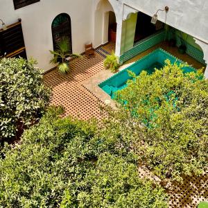 an overhead view of a swimming pool in a house at Riad Al Wifak in Marrakech