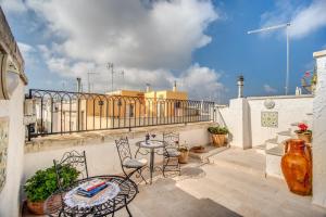 A balcony or terrace at Palazzo Stunis - Dimora di Charme