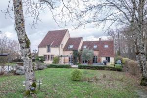 a large house with a large yard with trees at LES DENISOTS 12/14 PERS PISCINE PRIVEE in Lavau
