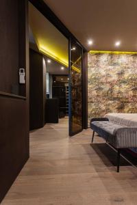 a bedroom with a bed in the middle of a hallway at Luxury apartment in the superb location in Chişinău