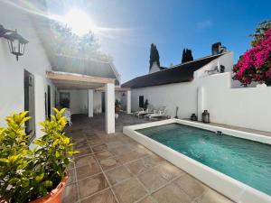 a swimming pool in the backyard of a house at Yellowwood House in Tulbagh