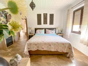 a bedroom with a large bed in a room at Casa Senna in Alicante