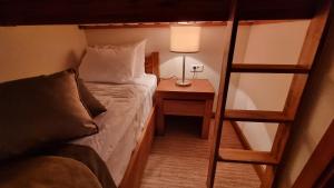 Ein Bett oder Betten in einem Zimmer der Unterkunft Apartman B428 Vucko