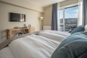 Una cama o camas en una habitación de Home Hotel Arcticus