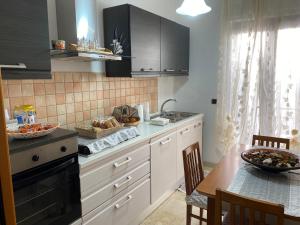 Kuchyňa alebo kuchynka v ubytovaní Via Bovio Guest House + 37 fotografií