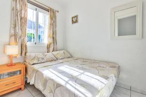 A bed or beds in a room at Los Gigantes Amazing Sea view WiFi Pool Parking