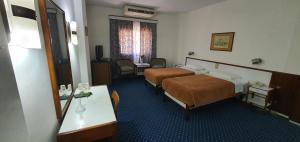 Postel nebo postele na pokoji v ubytování Horus House Hotel Zamalek