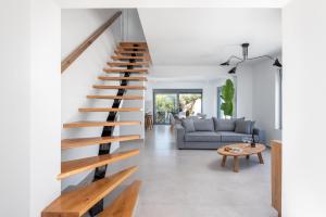 a staircase in the living room of a house at Villa Heather in Kolimbia +34 photos