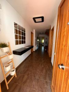 a hallway of an apartment with a hallway at Casa JyM Fontela 24 in O Pedrouzo