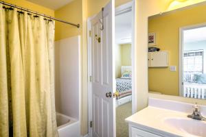 a bathroom with a sink and a mirror at Bethany Beach House 750 Feet from Ocean! in Bethany Beach +36 photos
