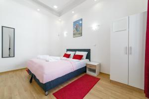 Ein Bett oder Betten in einem Zimmer der Unterkunft FG Apartments