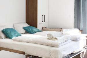 Ein Bett oder Betten in einem Zimmer der Unterkunft FG Apartments
