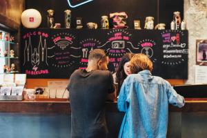 a group of people standing at a bar at Generator Barcelona in Barcelona