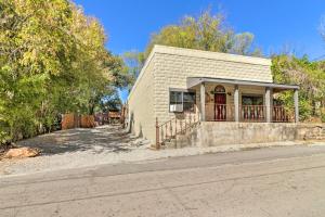 a small brick building on the side of a street at Quiet, Historic Manor Located in Ghost Town! in Calico Rock