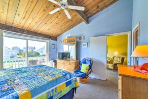 a bedroom with a bed and a desk and a window at Coastal Atlantic Beach Duplex Less Than 1 Mi to Boardwalk! in Atlantic Beach