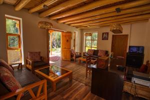 a living room filled with furniture and a table at Chalet Seabuckthorn - Hunder in Hundar