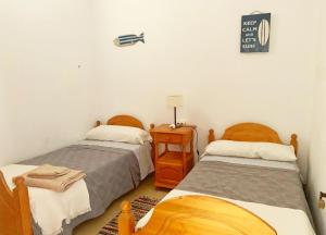 En eller flere senger på et rom på Casa a 65 metros de la Playa