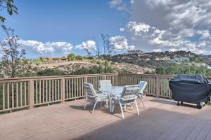 a patio with a table and chairs on a deck at Hilltop Hideaway in Temecula Wine Country in Sage