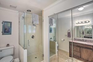 a bathroom with a shower and a toilet and a sink at Charming Shasta Lake Retreat Boat, Hike and Fish! in Lakehead +23 photos