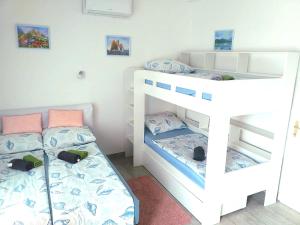 Posteľ alebo postele v izbe v ubytovaní Villa Dora ##2
