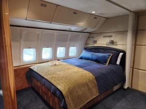 a bed in the middle of an airplane cabin at AEROTEL VIP in Hoedspruit