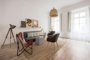 Televízia a/alebo spoločenská miestnosť v ubytovaní Atelier Apartment