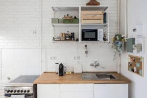 Kuchyňa alebo kuchynka v ubytovaní Atelier Apartment