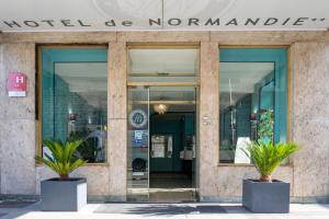 a building with a sign that reads motel de normander at Hotel de Normandie in Lyon +28 photos