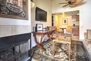 a living room with a desk and a fireplace at Pet-Friendly Las Vegas Condo 1 Mi to the Strip! in Las Vegas