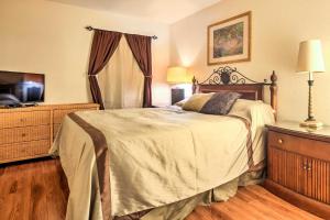 a bedroom with a large bed and a television at Pet-Friendly Las Vegas Condo 1 Mi to the Strip! in Las Vegas +17 photos