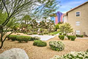 a garden with bushes and trees and a building at Pet-Friendly Las Vegas Condo 1 Mi to the Strip! in Las Vegas