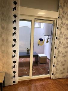 a room with a sliding glass door to a balcony at CHEZ GREDOS in Candeleda