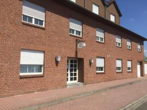 a brick building with a door on the side of it at IVY Hotel in Wolfsburg