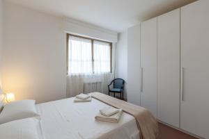 מיטה או מיטות בחדר ב-Residence Caravel 25