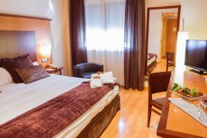 Postel nebo postele na pokoji v ubytování Hotel Bardo Recoletos Coco