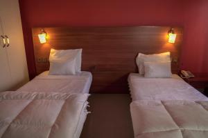 Postel nebo postele na pokoji v ubytování Dialali Hôtel Nouakchott